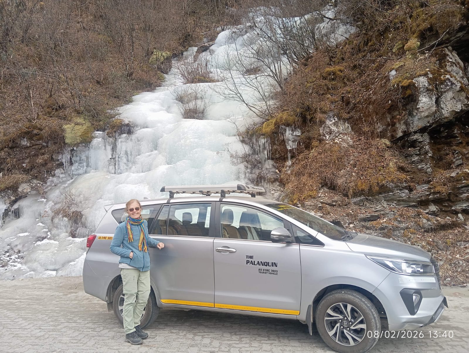 Guest with PalanQuin Innova Crysta at a frozen waterfall in Arunachal Pradesh